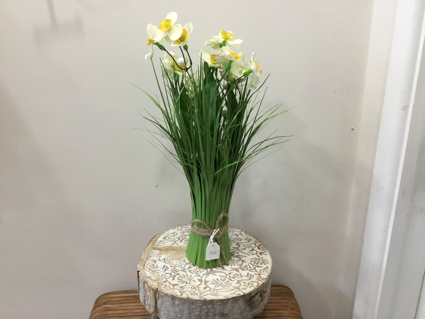White with yellow centre daffodil standing grass bouquet