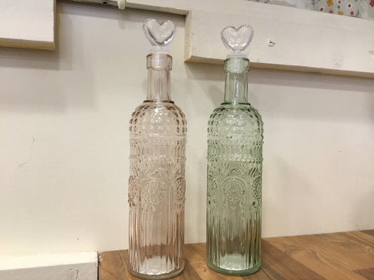 Glass bottle. With heart stopper