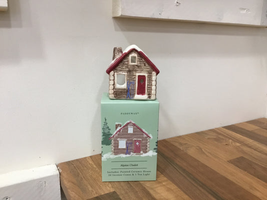 Alpine chalet with tea light and incense cones