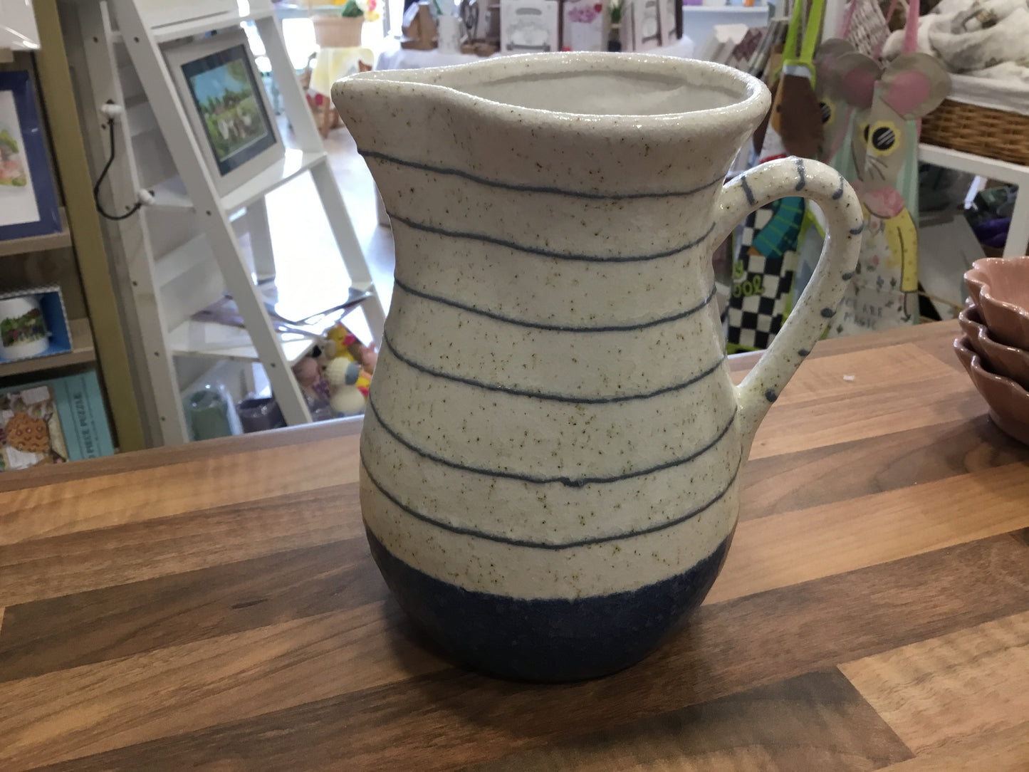 Blue and white stripe stone jug