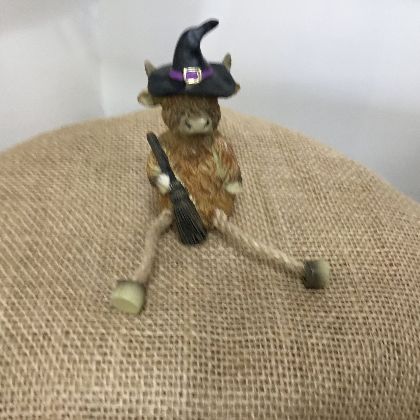 Highland cow witch figure