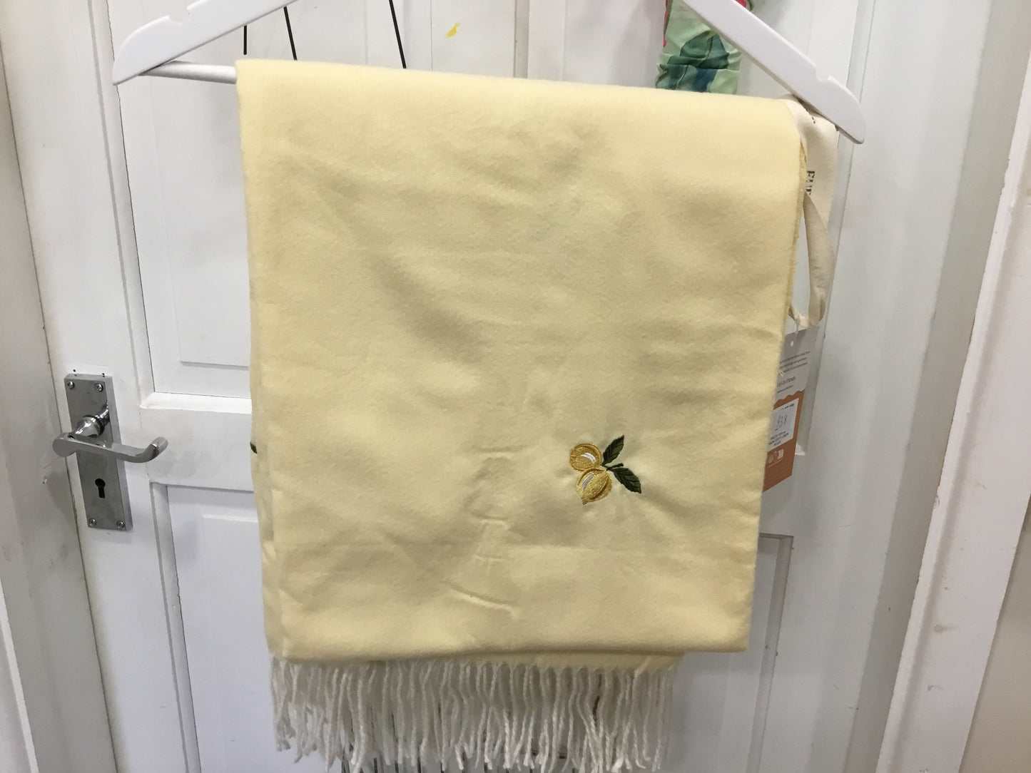 Embroidered lemon design throw