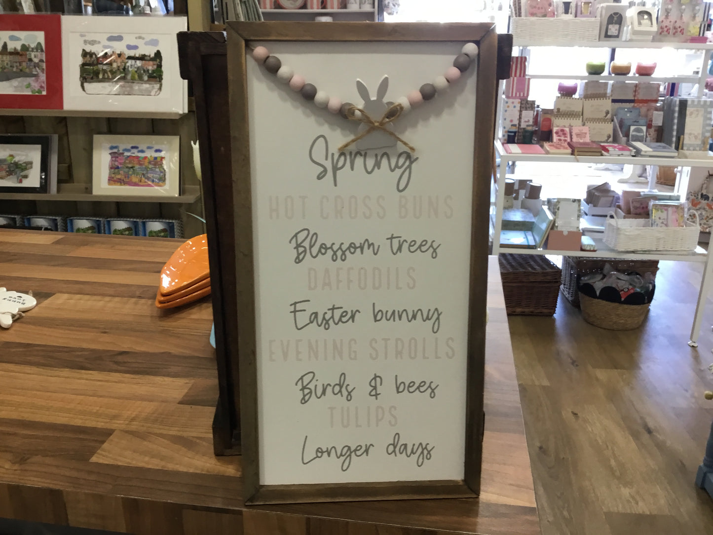 Spring hanging sign