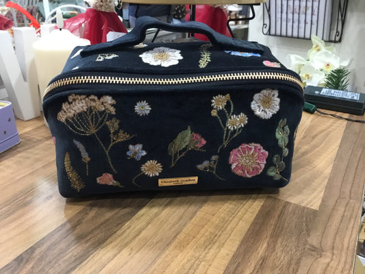 Elizabeth Scarlett. Open flat make up bag.