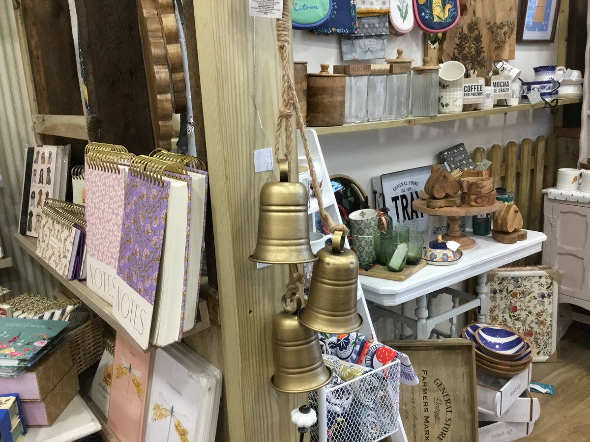Three gold colour bells on rope
