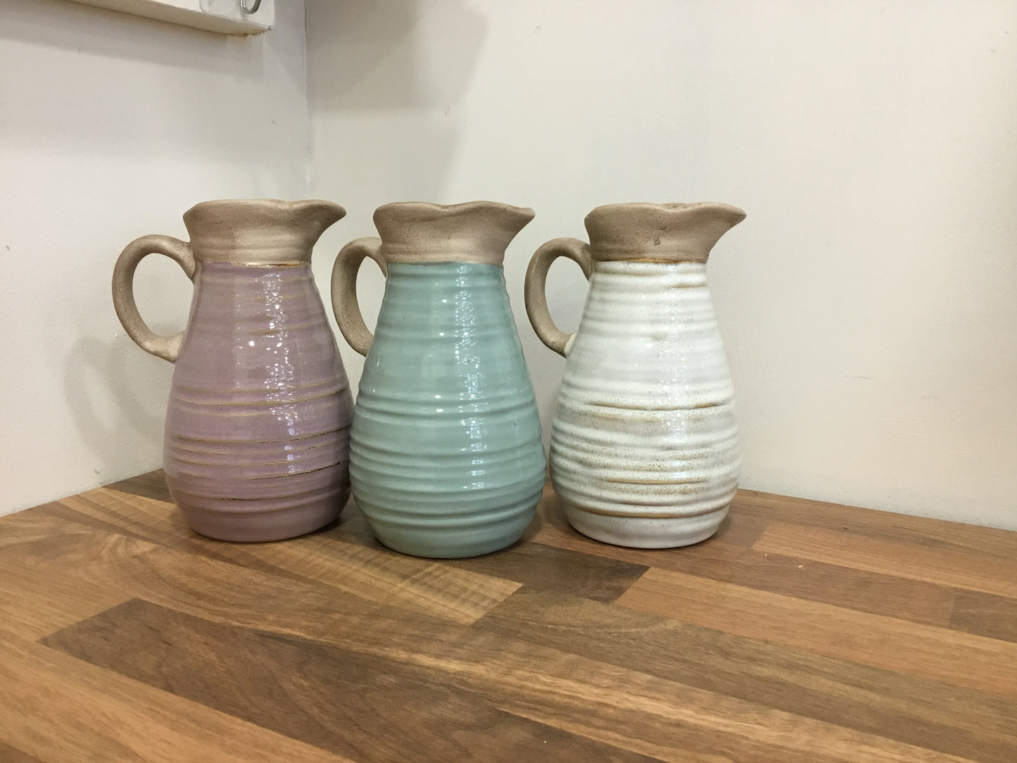 Small ceramic jug in three colours