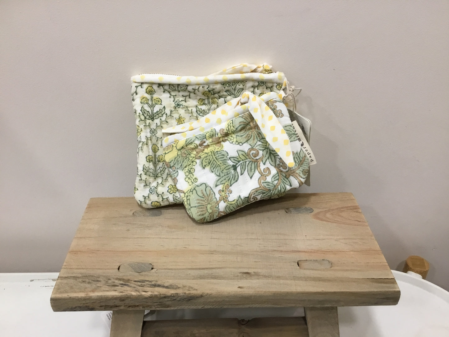 Set of two organic cotton zipped pouches.
