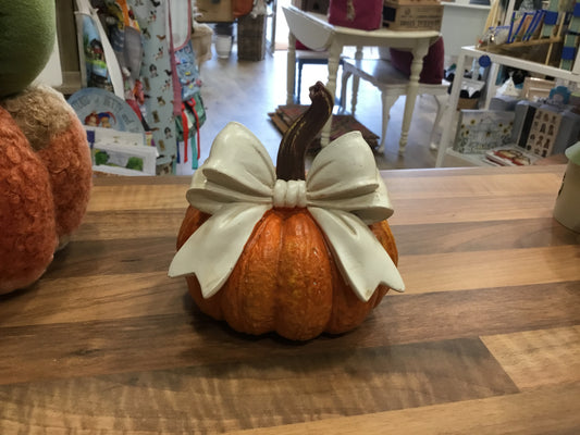 Large pumpkin with white bow