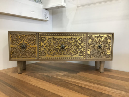 Wooden set of drawers with gold effect