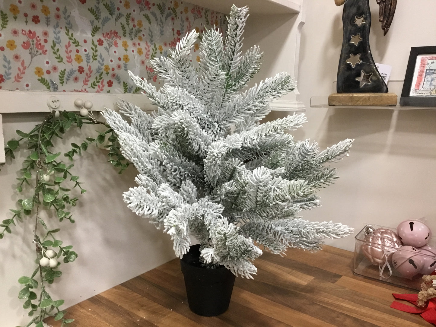 Indoor snowy Christmas tree.
