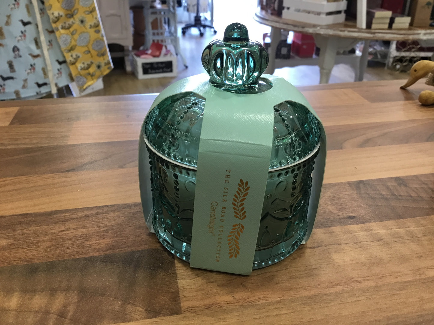 Green glass candle