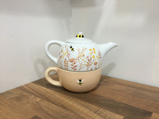 Floral teapot and cup.