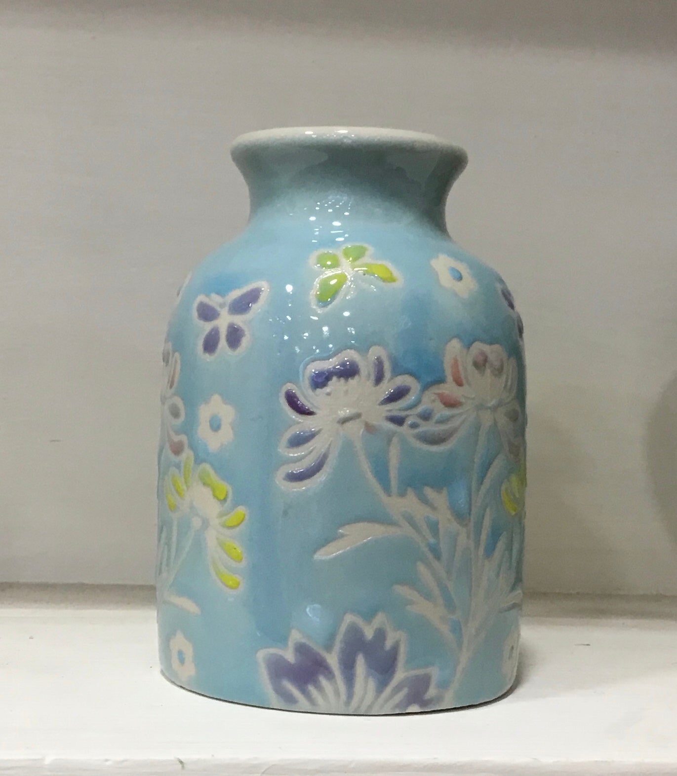 Blue floral ceramic bud vase