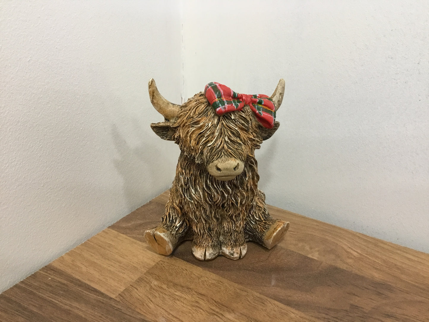 Highland cow with bow