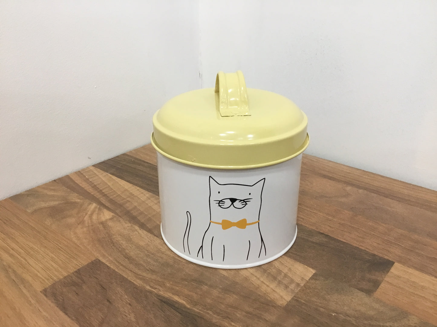 Yellow enamel cat treat canister