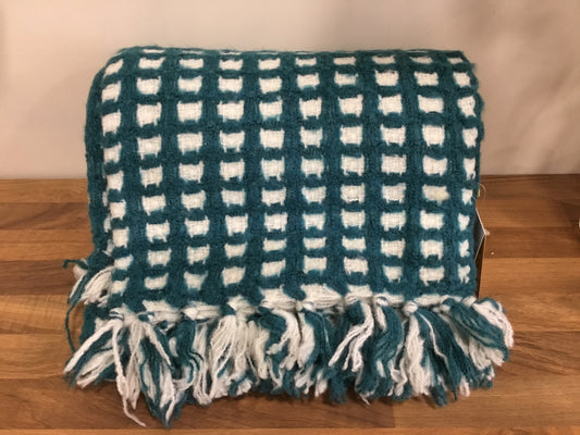 Teal and cream throw