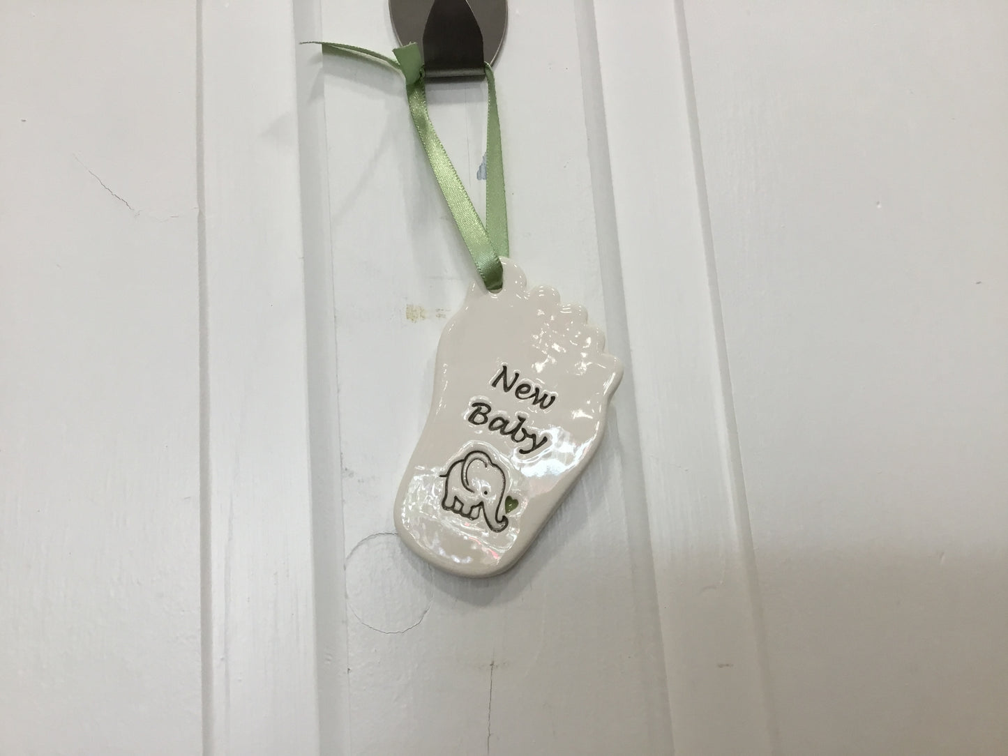Ceramic baby girl foot. Ceramic new baby foot