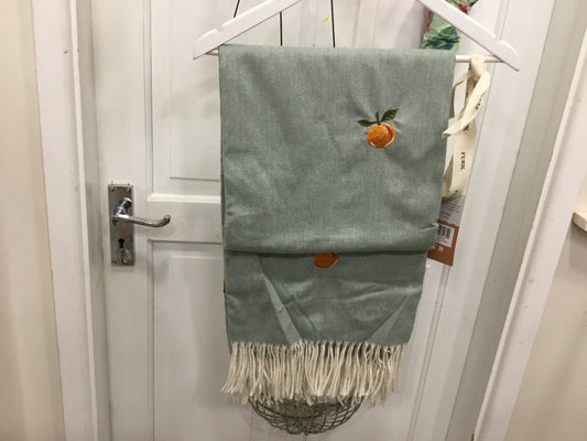 Embroidered orange design throw