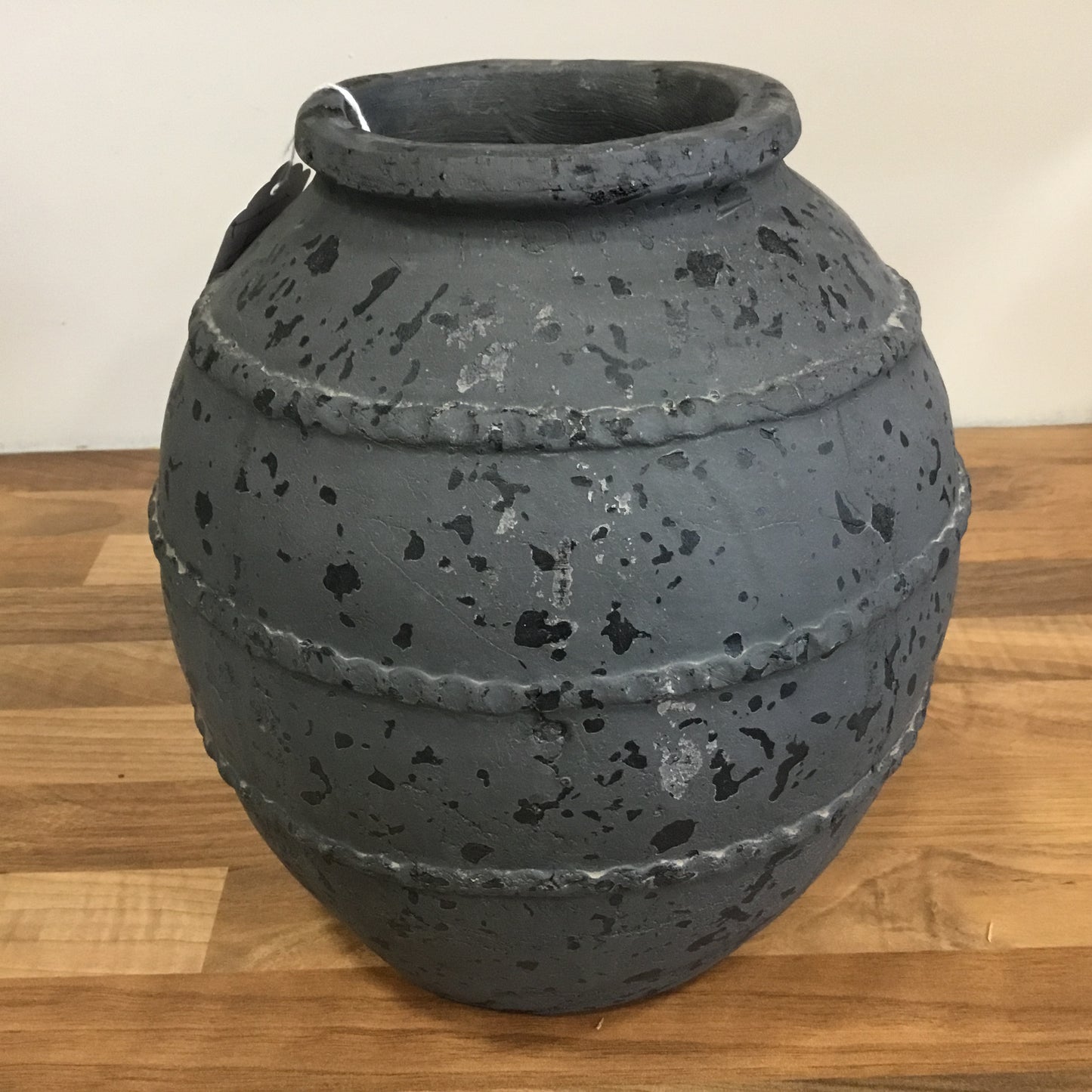 Round dark grey stone vase