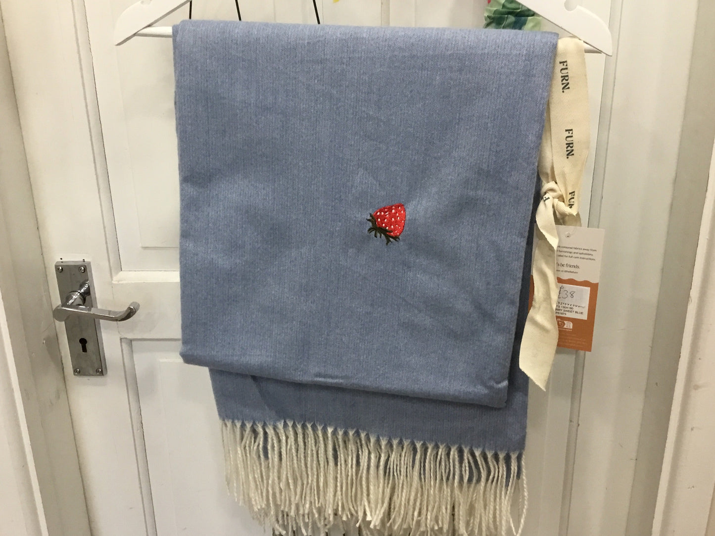Embroidered strawberry design throw