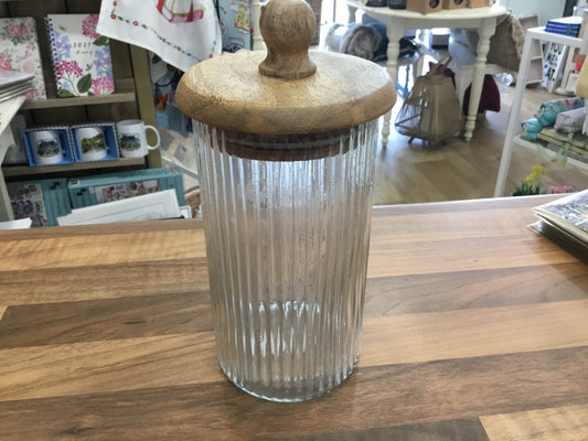 Glass ribbed storage jar with wooden lid