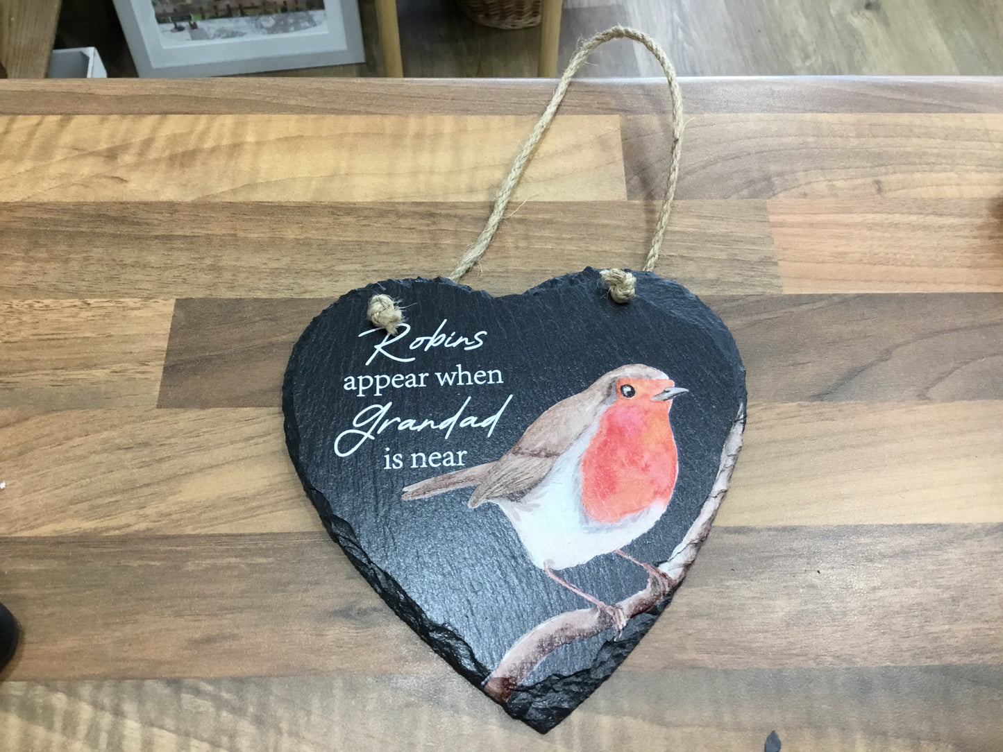 Robins appear when Grandad is near slate plaque