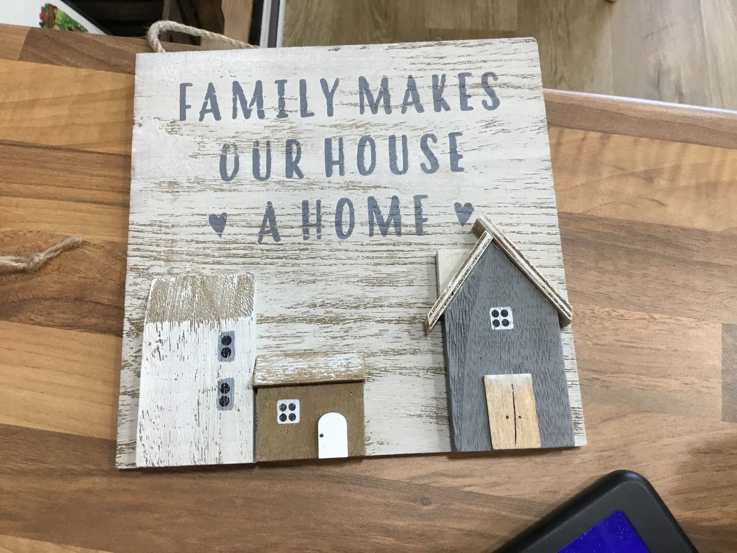 Family makes a house a home plaque