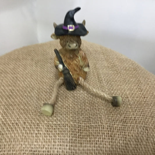 Highland cow witch figure