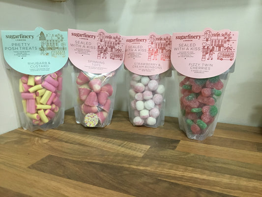 Sweets. Fizzy cherries. Rhubarb & Custard. Bonbons. Spinning tops.