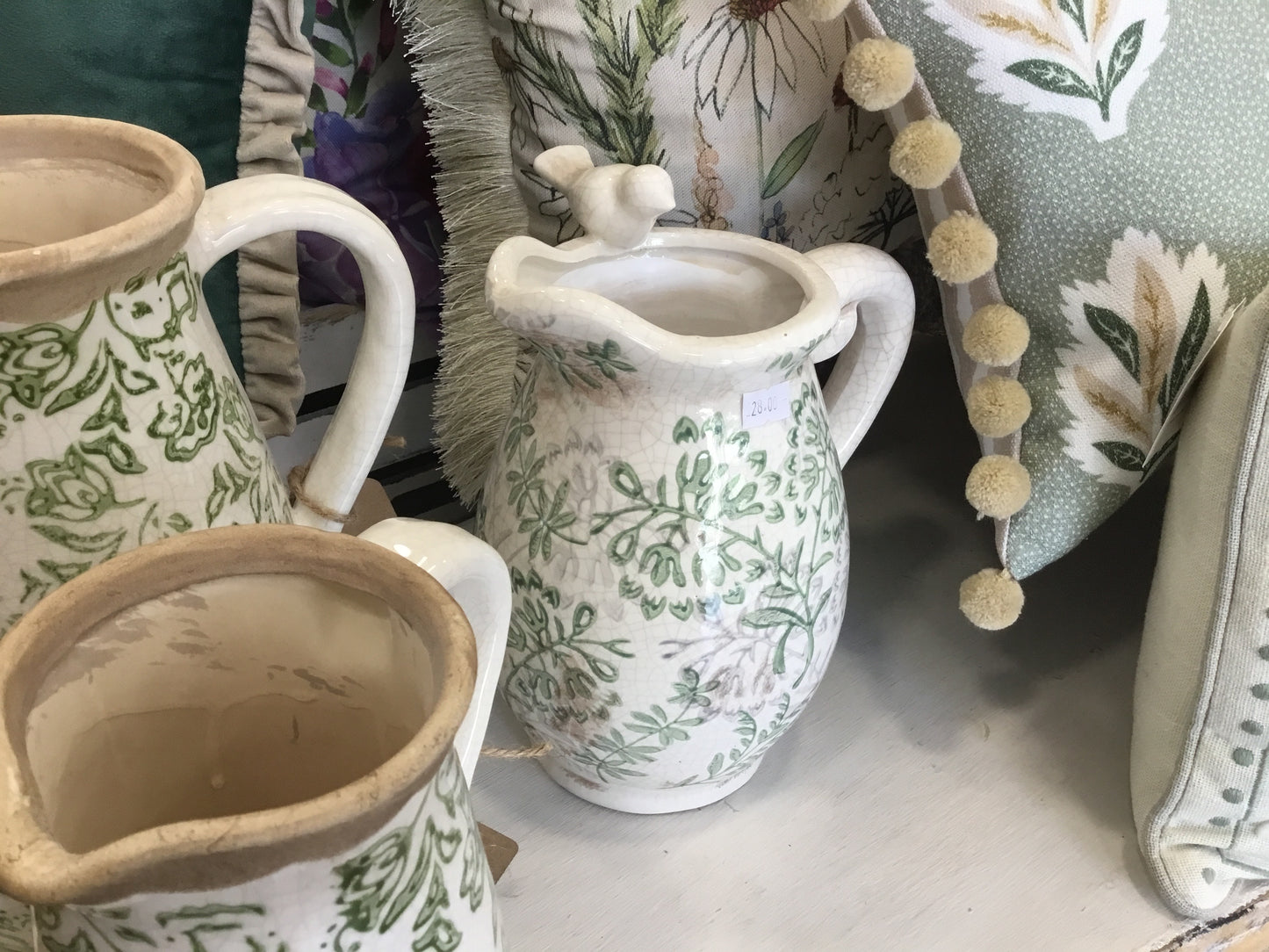 Large ceramic green and white jug with bird